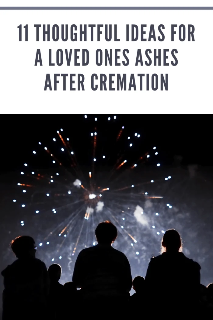 A family gathered together, watching vibrant fireworks that scatter loved ones' ashes into the night sky.