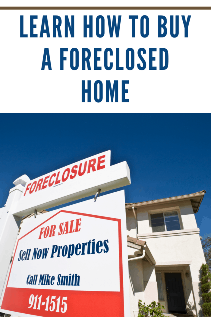 foreclosed home with real estate agent sign