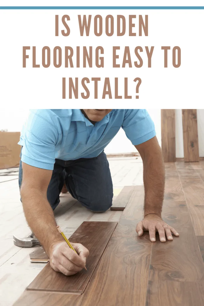 man installing wooden flooring