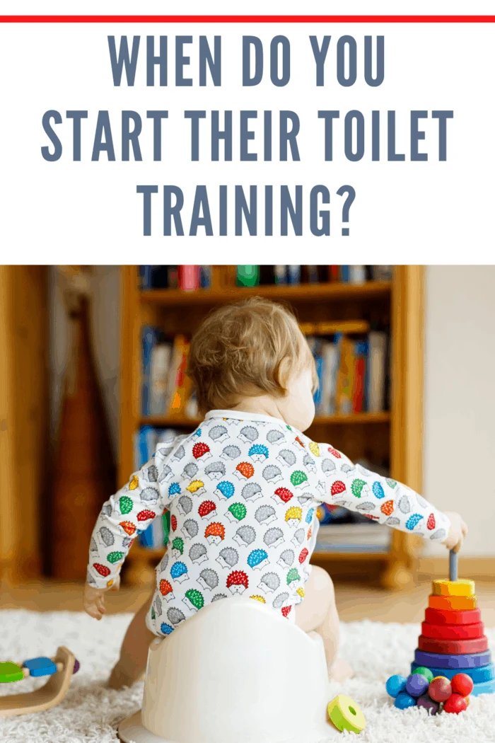 small child on potty training toilet