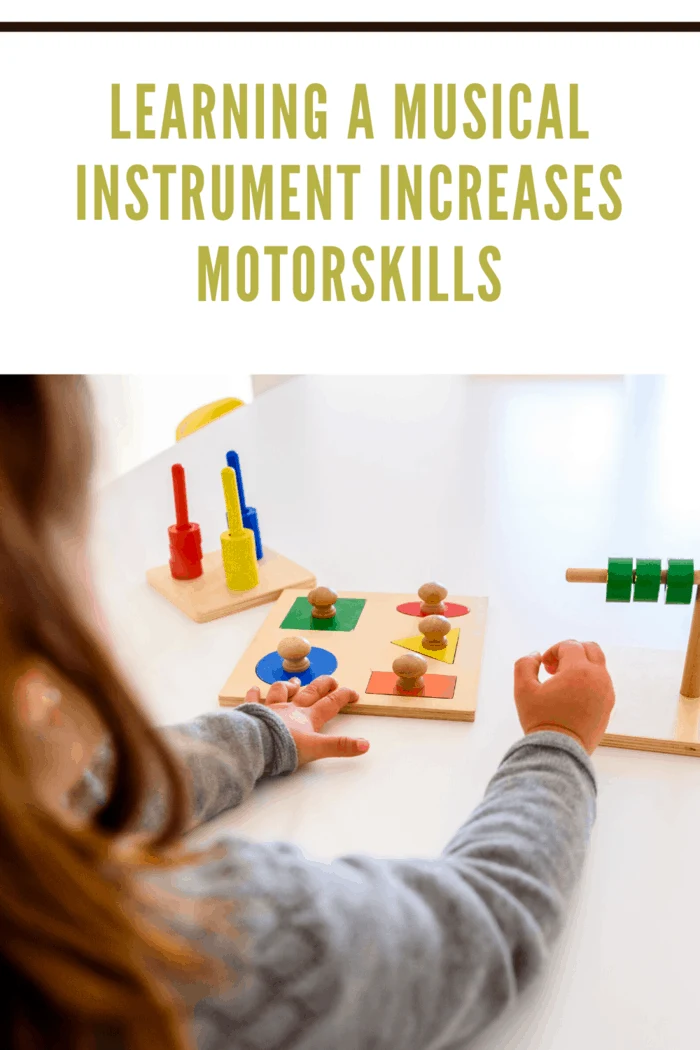 small child playing with wooden puzzles