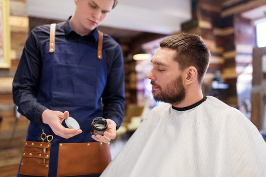 barber talking to client about hair wax