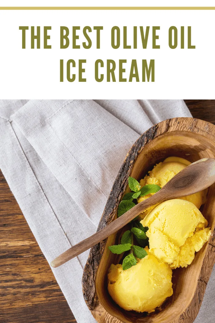 creamy olive oil ice cream scooped into a wooden bowl