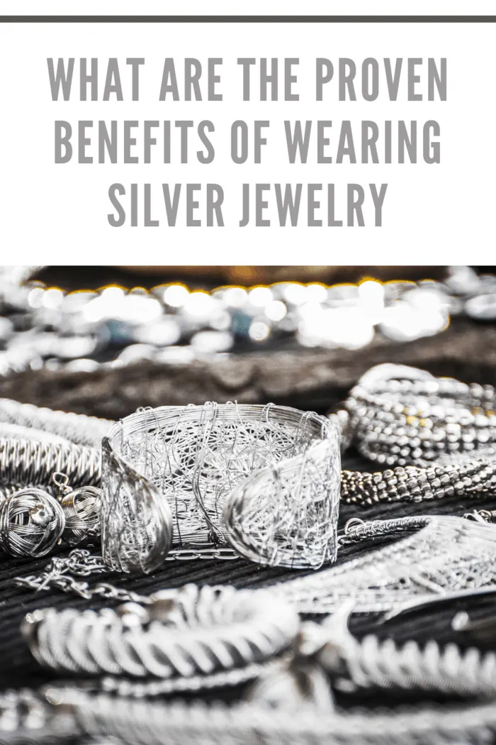 Close-up of silver jewelry showcasing the health benefits of wearing silver.