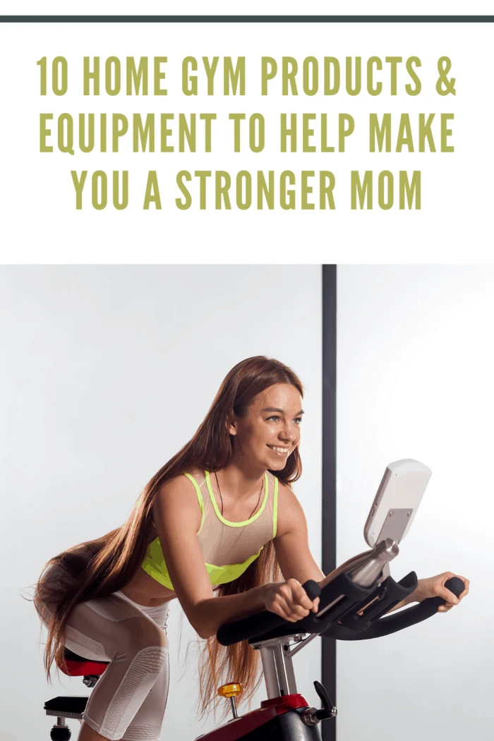 woman with long hair working out at home on stationary bike