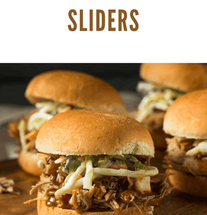 Baked BBQ chicken sliders with shredded barbecue chicken, red onion, melted cheese, and buttery golden rolls