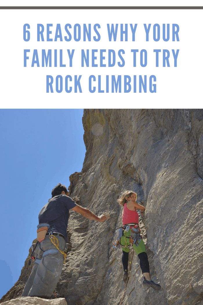 child rocking climbing while dad stands by to assist