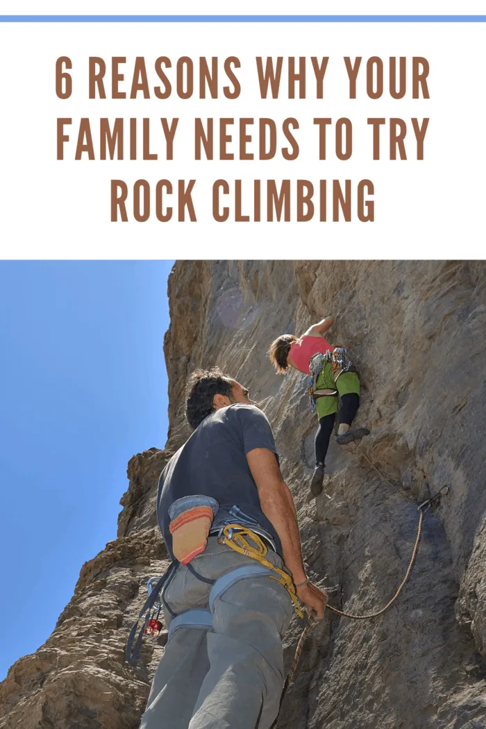 child rocking climbing while dad stands by to assist