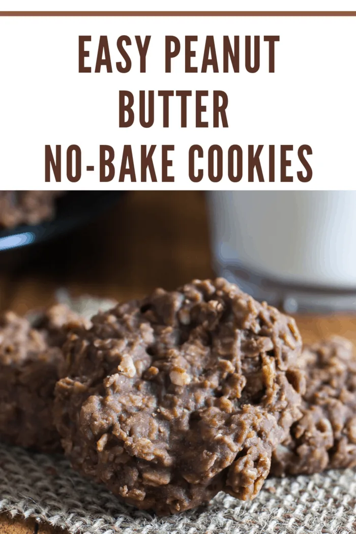 peanut butter no bake cookies on burlap napkin on table next to milk