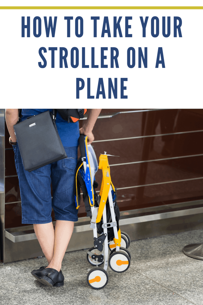 man standing at airport waiting to get folded stroller on a plane