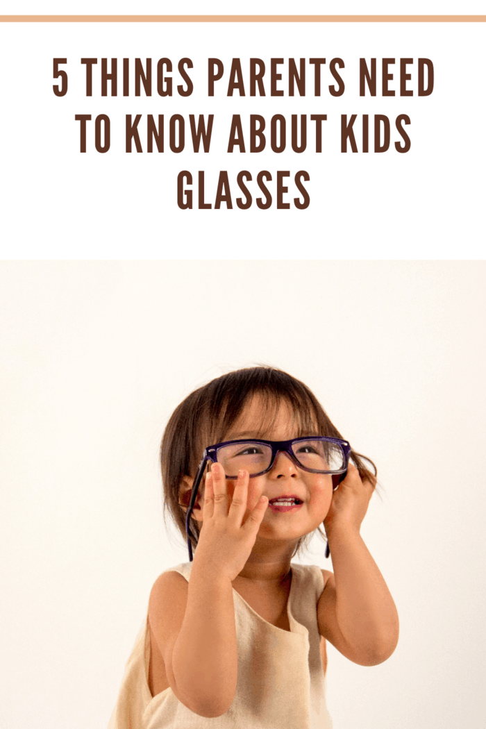 little girl with adult glasses on