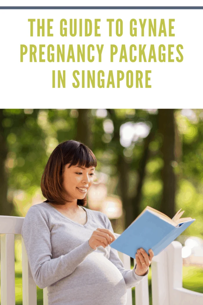 pregnant woman reading on white bench