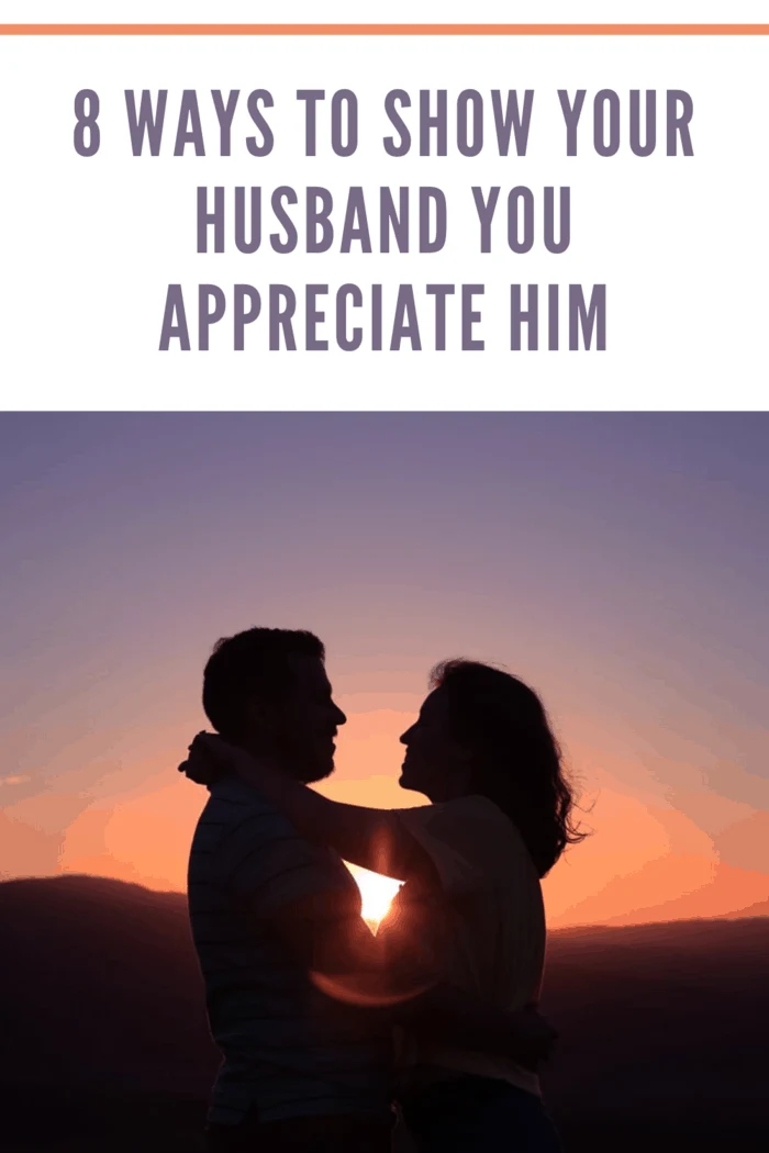 sunset with silhouettes of husband and wife hugging
