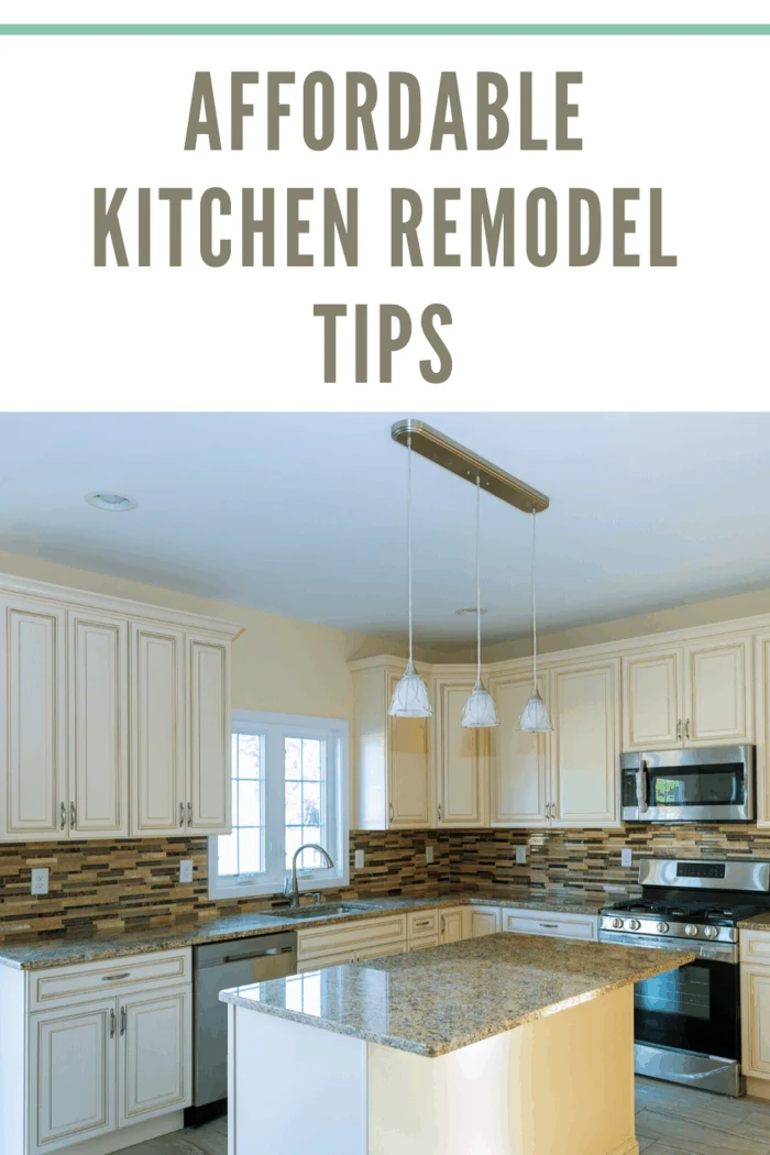 white kitchen remodel with tile backsplash and granite countertops