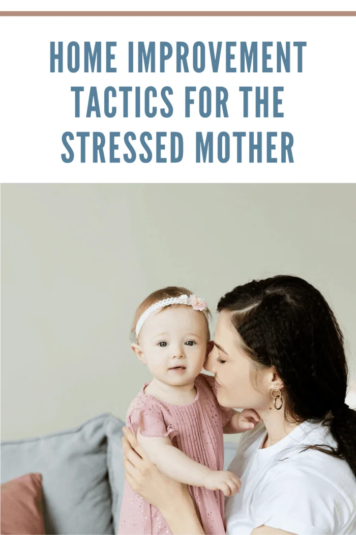 young mother cuddling toddler daughter in mauve dress with matching headband