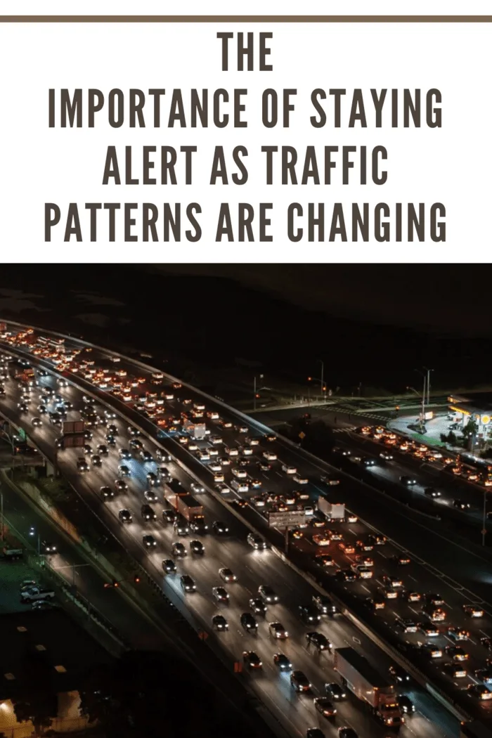 headlights on freeway at night illuminating the traffic pattern