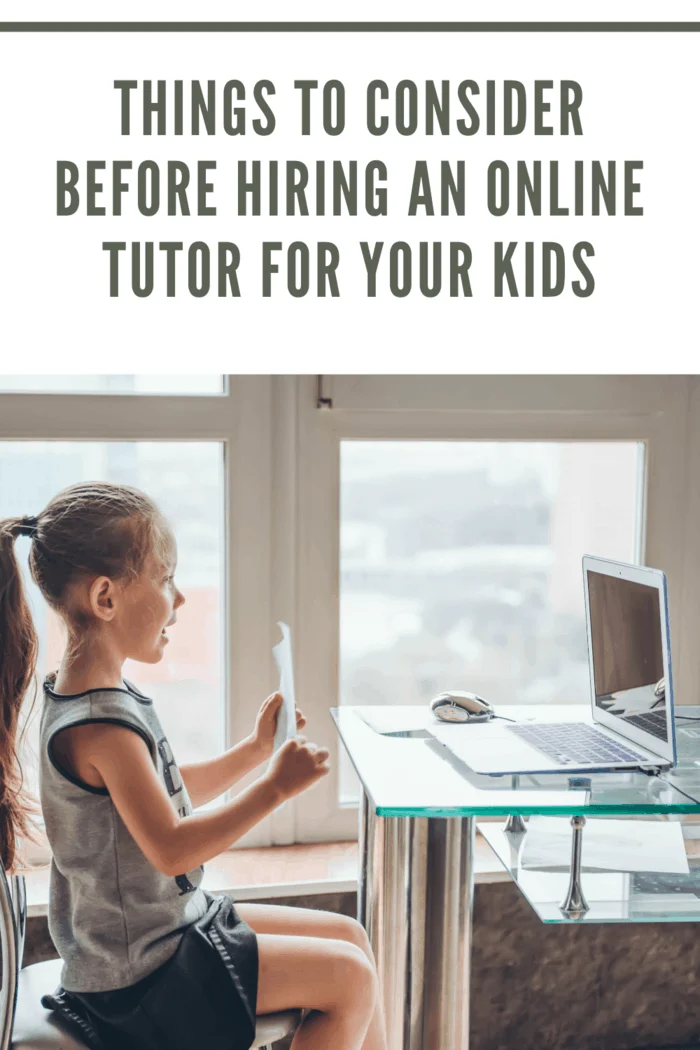 girl holding up paper for online tutor