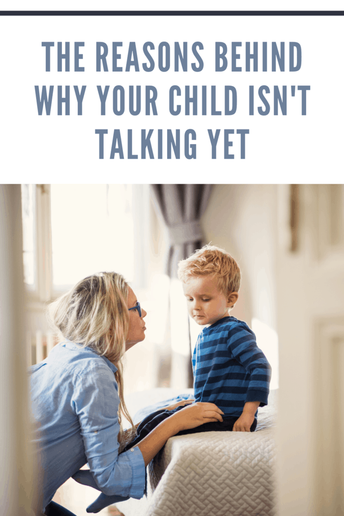 mother kneeling with child on table who is not talking yet