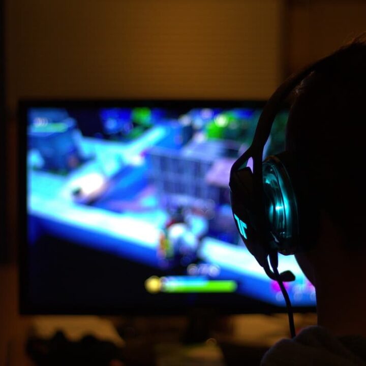 person engaging in gaming experience playing fortnite