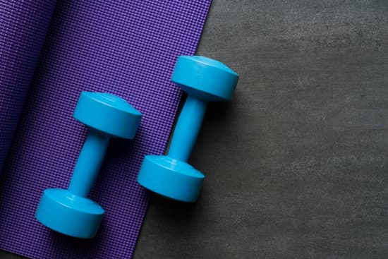 purple exercise mat with blue dumb bells