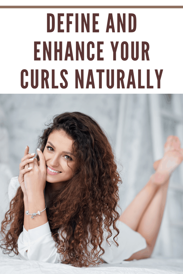 girl laying on stomach with long curly hair