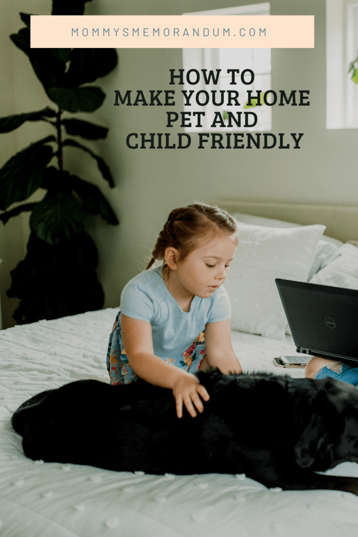 small girl on bed with black dog