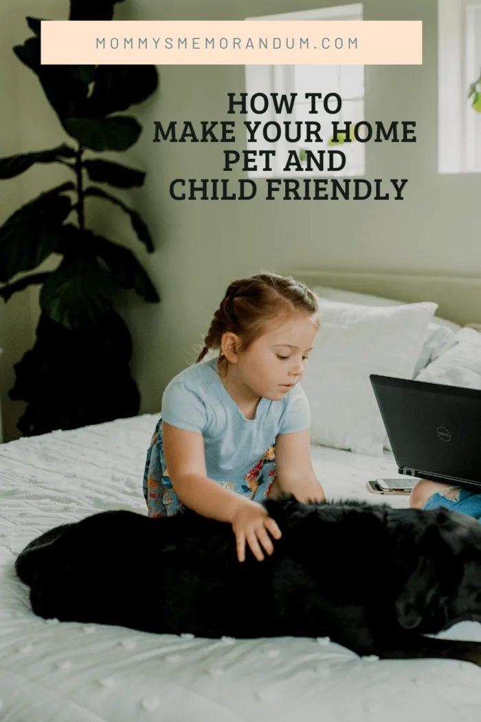 small girl on bed with black dog