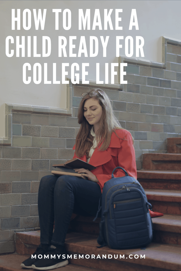college student sitting on steps studying with book