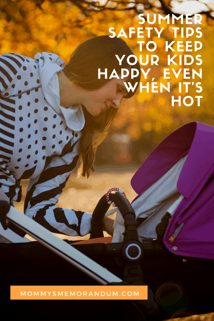 mom looking at baby in stroller at twilight hour