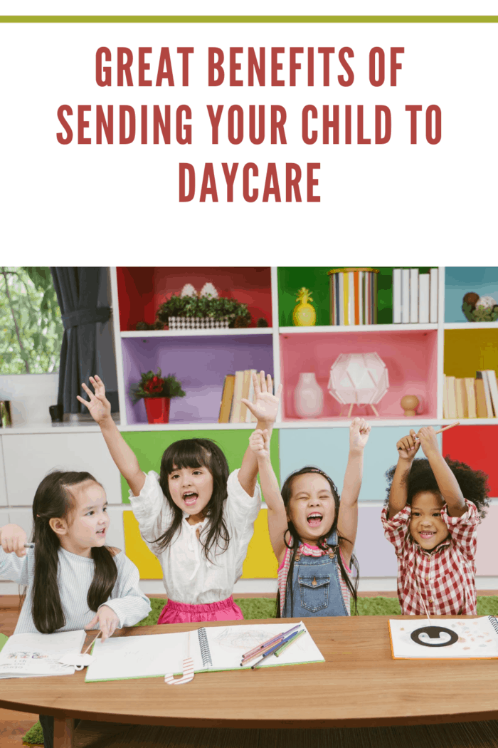children at daycare raising hands for lesson