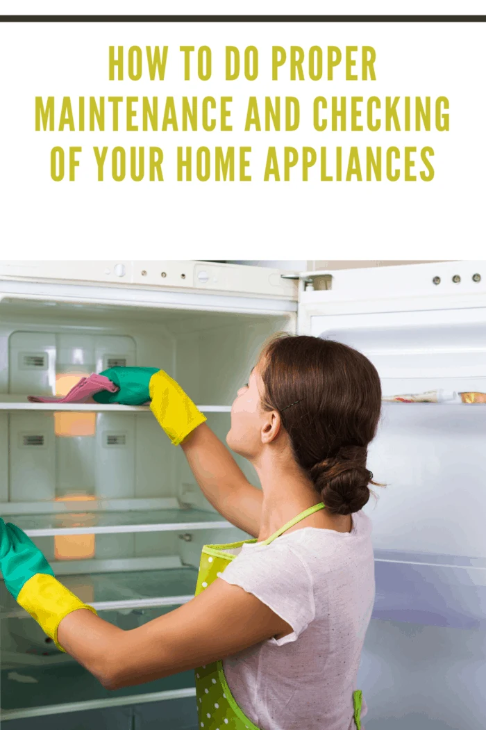 Adult housewife cleaning refrigerator inside and smiling