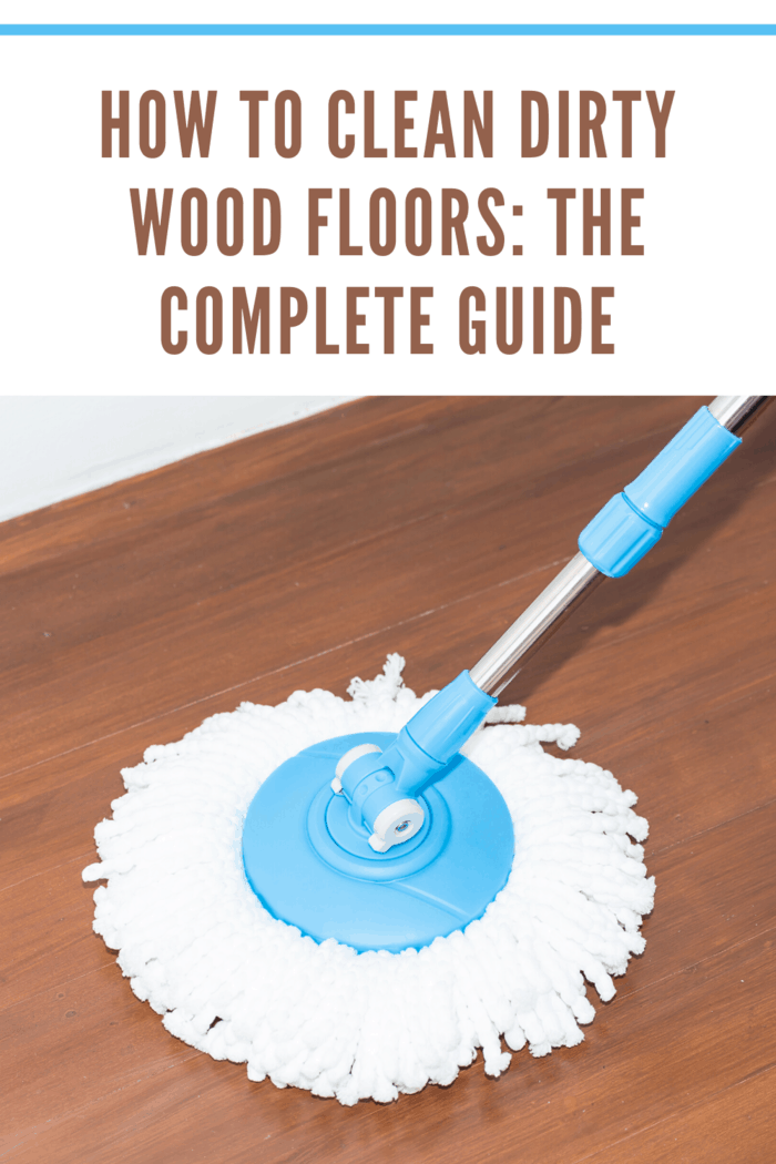 Cleaning dirty wood floors by use modern mop on laminated wood floor.