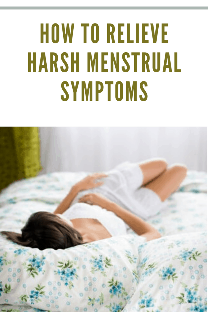 woman laying on bed hoping to relieve harsh menstrual symptoms
