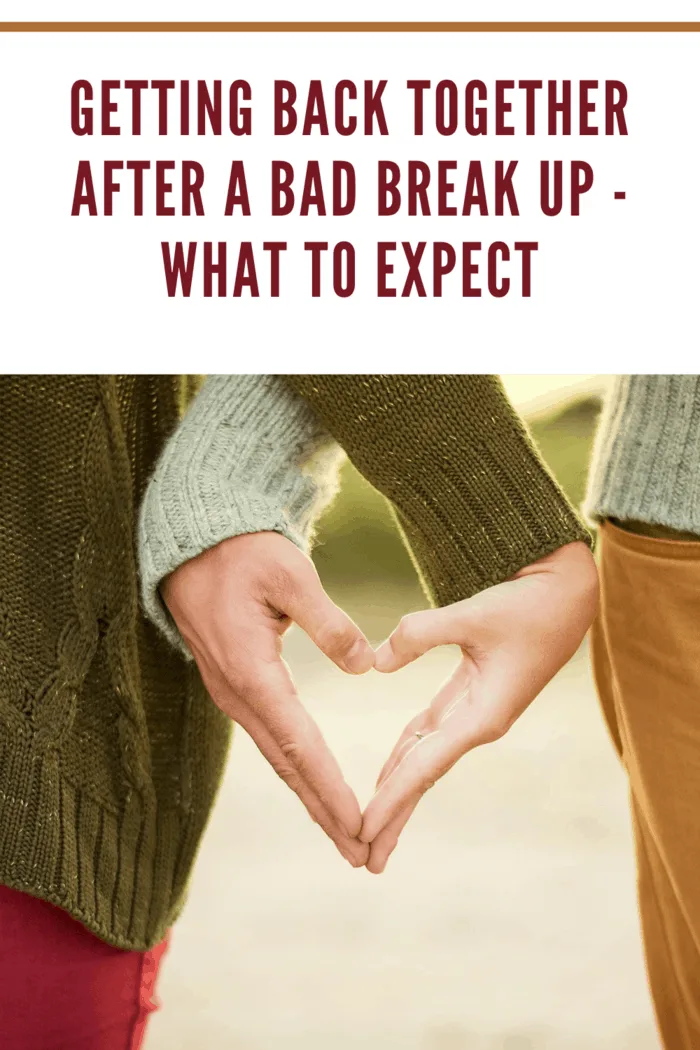 man and woman walking side by side with each of their hands forming one half of a heart