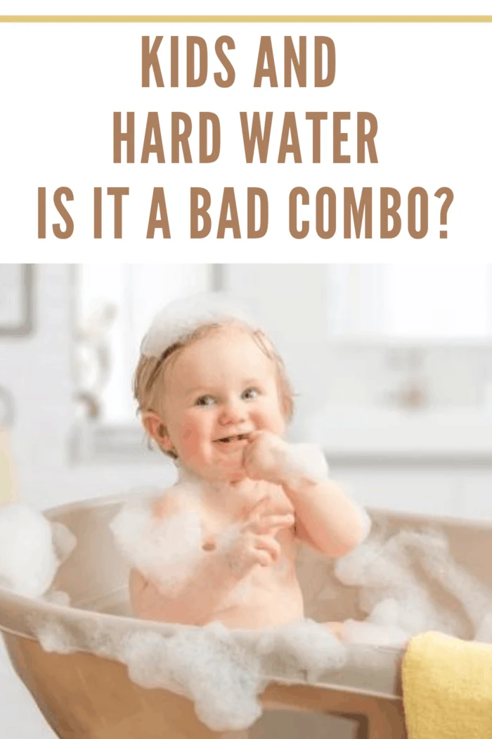 toddler taking a bubble bath on counter