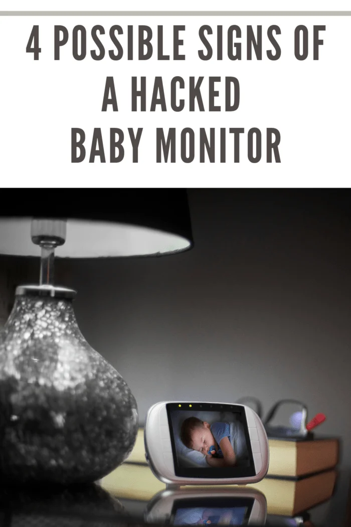 Baby monitor on bedside table in the bedroom with the image of the baby sleeping on the screen