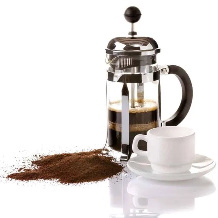 French press coffee maker on white background with reflection