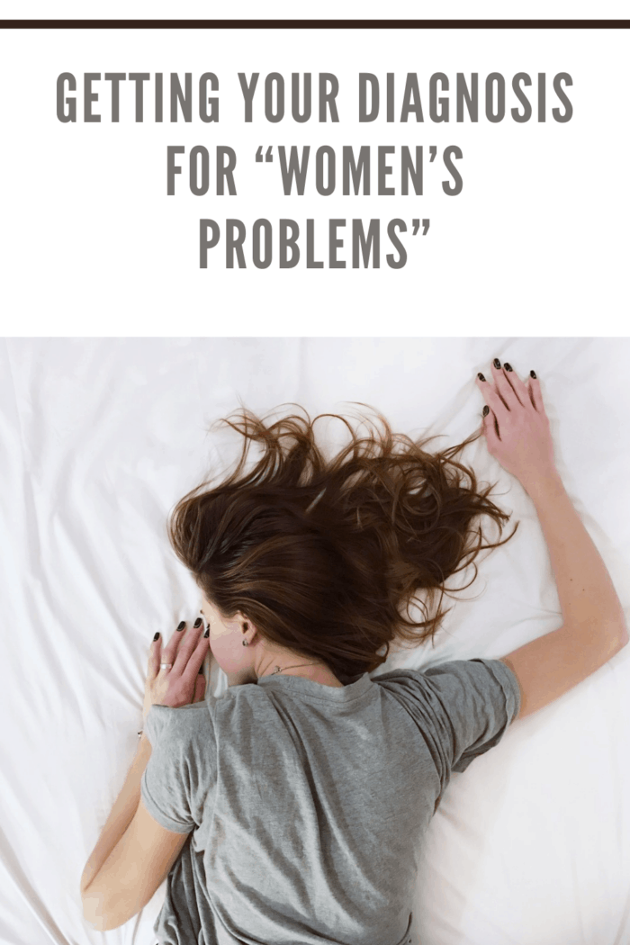 woman on bed on stomach with women's issues