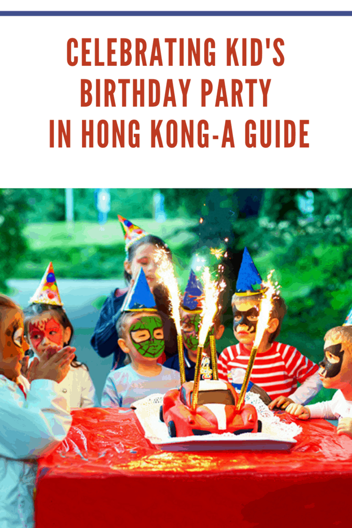 kids birthday party hong kong where kids faces are painted like superheros and they are gathered around cake.