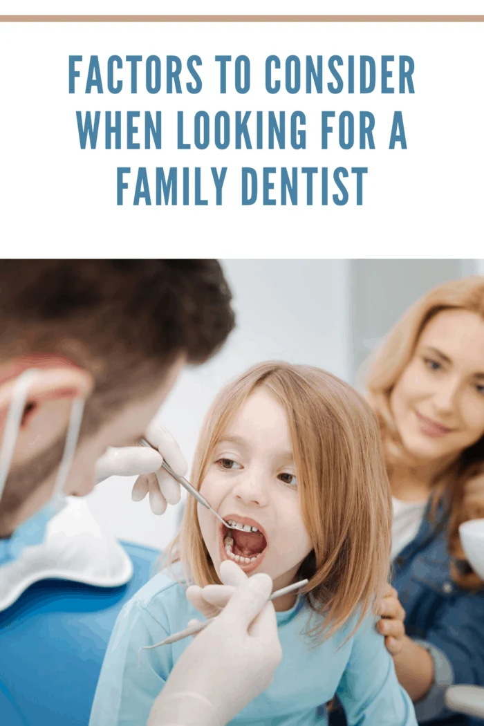 Nice good tempered patient child paying a regular visit to her dentist and sitting still with her mouth open while he examining her teeth after her mom researched choosing the best dentist