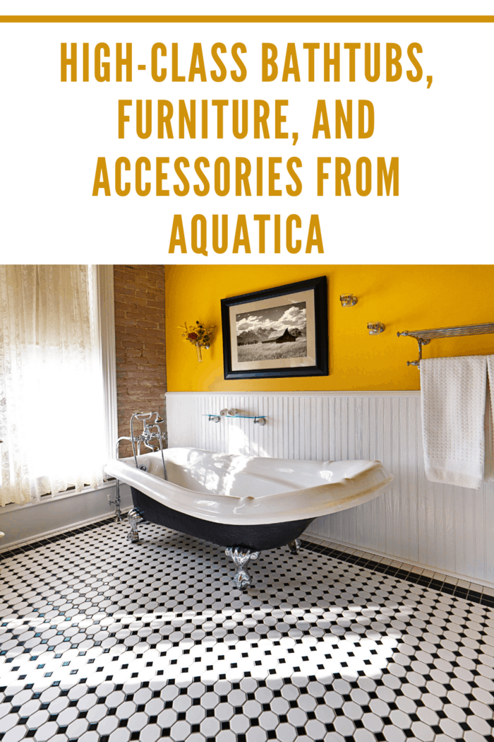 A modern contemporary classic bathroom design, furnished with a classic painted cabinet, sepia toned picture on the wall, exposed brick wall and a window, a claw foot bath tub and black and white tile pattern on the floor. Photographed in horizontal forma