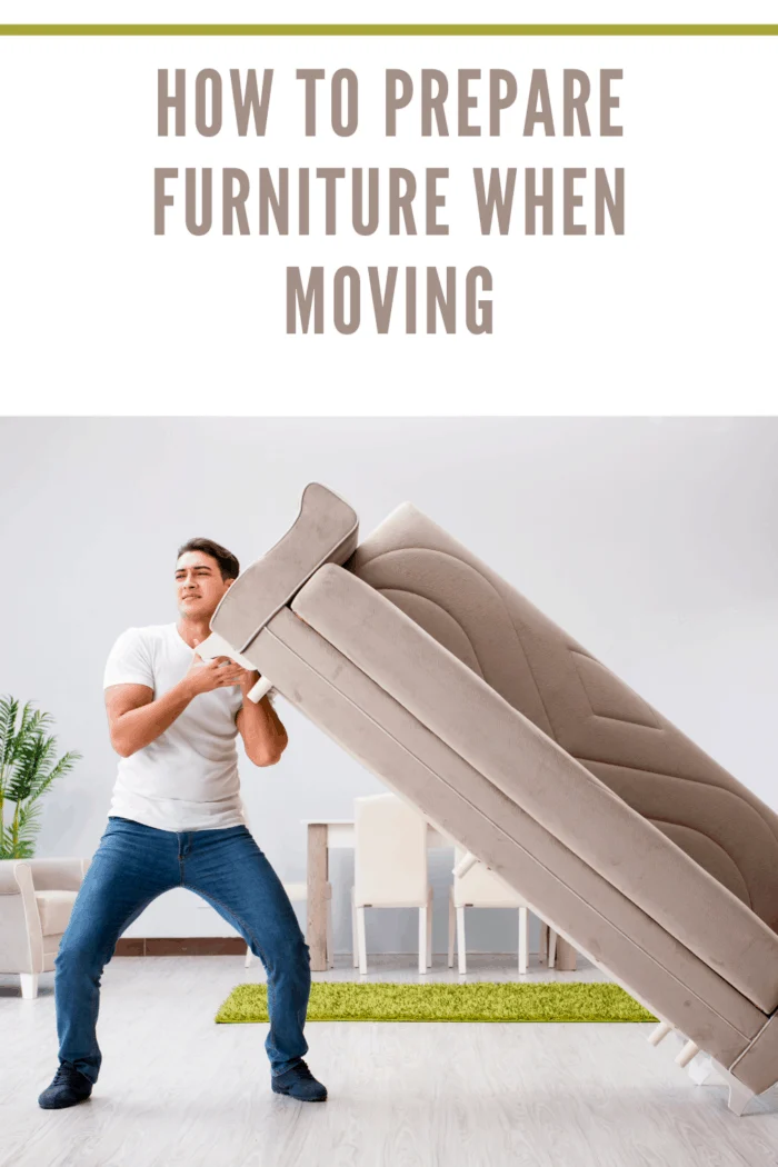 Young man moving furniture at home before learning how to prepare furniture for moving