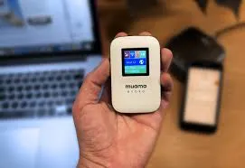 Muama Ryoko 4G Wi-Fi Router held in hand, showcasing its small size and convenient portability