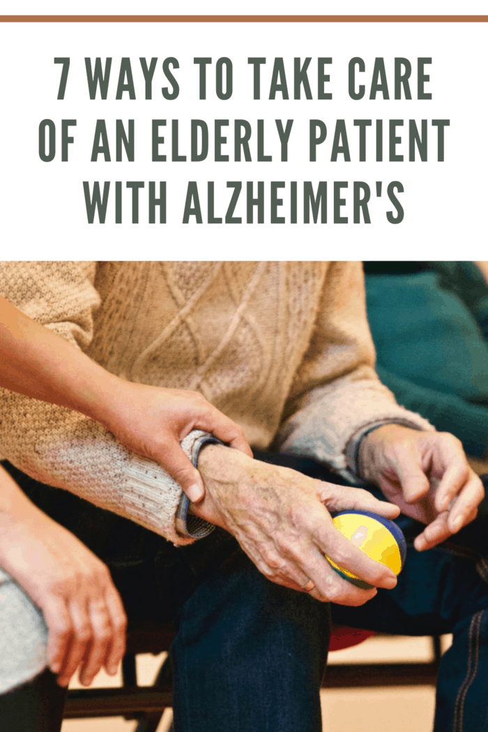 elderly patient with alzheimer's being cared for and using ball for therapy