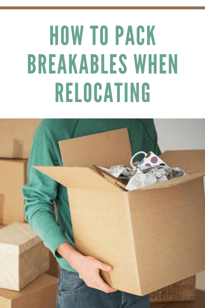 person packing breakables when relocating to a new city