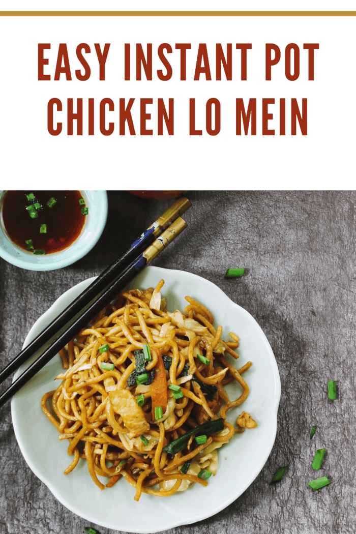 Homemade Chinese Lo Mein served with green tea overhead view