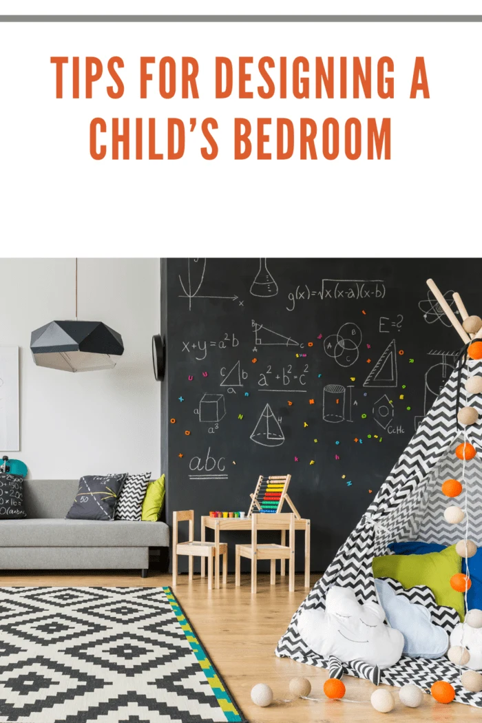 Spacious black and white child room with window, sack chair, regale, sofa, carpet, chalkboard wall, small table, chairs and play tent