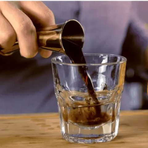 homemade instant pot kahula being poured into a glass