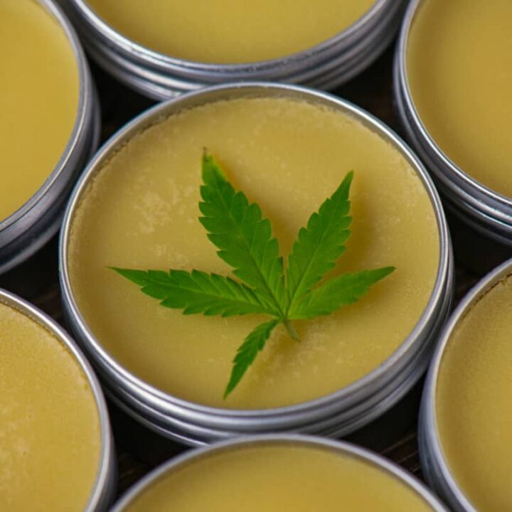 Cannabis hemp cream background with hemp leaf - cbd topicals concept