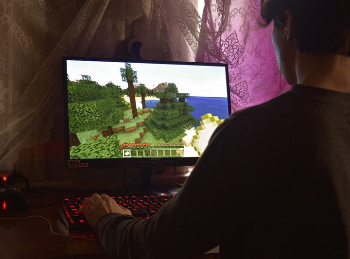 male playing game on gaming monitor